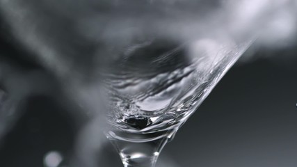 Water splash in martini glass shooting with high speed camera. - Powered by Adobe