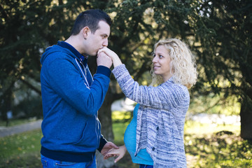 Young pregnant couple in the park