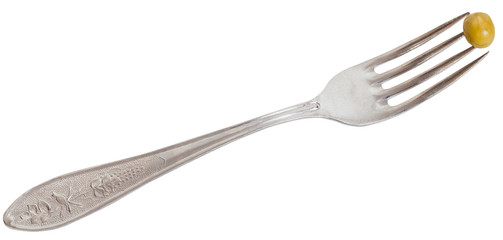 fork with one green pea seed isolated