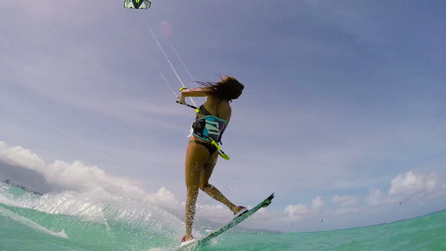 Woman Kite Boarding Extreme Summer Sports POV GOPRO Slow Motion. Young Woman Kitesurfing in Ocean in Bikini. 