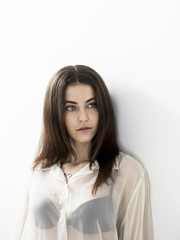 Obraz premium Beautiful girl portrait wearing white see-through blouse