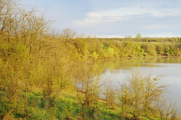 Fototapeta na wymiar Countryside wild landscape with little lake