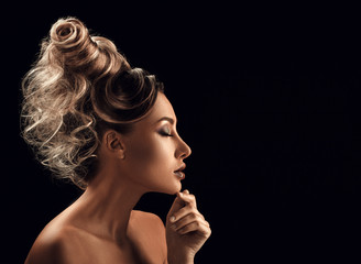 Portrait of Beautiful Young Woman with hairstyle touching her fa