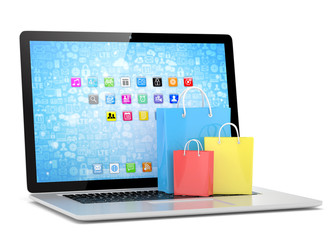 laptop and  shopping pags on white background