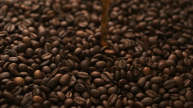 Pouring coffee over coffee beans shooting with high speed camera, phantom flex.