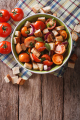 Panzanella salad on a plate. vertical top view
