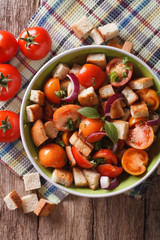 Panzanella salad close-up on a plate. vertical top view
