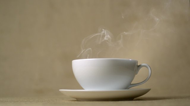 Steam coming out of cup of hot drink shooting with high speed camera, phantom flex.