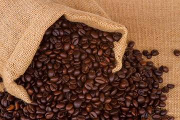 Coffee bag - coffee beans in canvas coffee sack isolated on canvas background