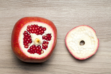 The cut-off top of the pomegranate on the table.