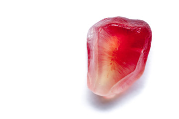 Garnet seeds on the white background.