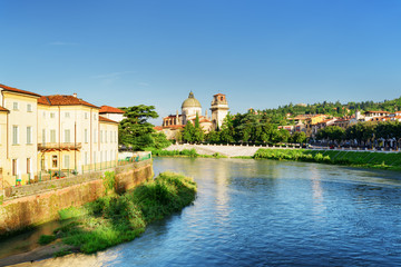 Fototapeta na wymiar View of Adige River and Church of San Giorgio in Braida, Verona