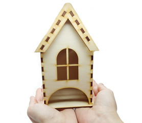 hand holding house miniature savings concept