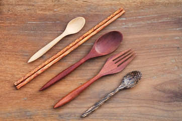Wooden Spoon, fork, chopsticks on rustic wooden background