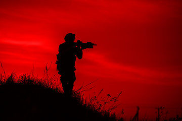 Obraz na płótnie Canvas Silhouette of soldier with rifle..
