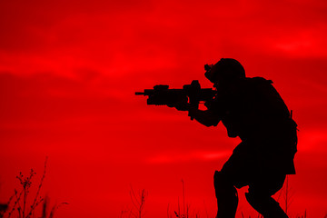 Silhouette of soldier with rifle..