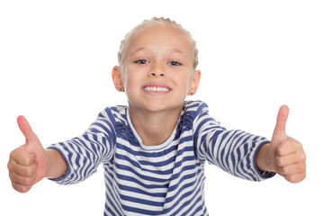 Smiling little girl with thumbs up