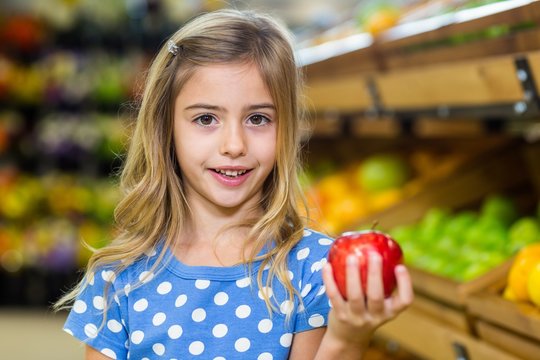 Cute Girl Holding An Apple