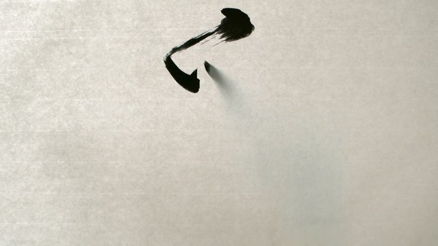 Writing calligraphy "Love" in Chinese character shooting with high speed camera, phantom flex. 