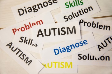 Obraz premium Autism words on wooden table