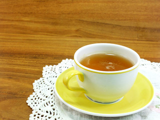 cup of tea on wooden background with Tablecloth