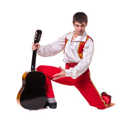 Dancing man wearing a toreador costume with guitar. Isolated on white in full length