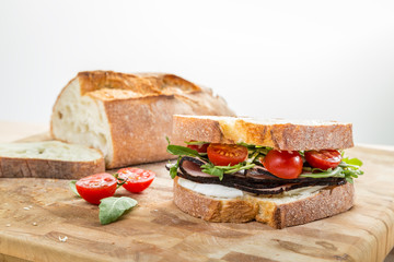 ciabatta sandwich with ham and grape tomato