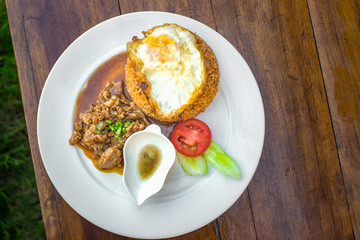 Fried Rice with Chicken Source On The Wood Table 