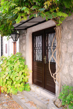 The image of butiful entrance of a stone house