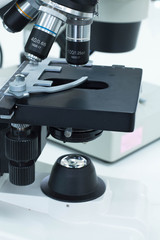 Close up of microscope lenses focused on a specimen