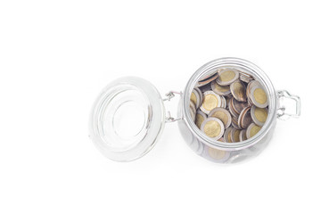 Glass jars with coins money on white background