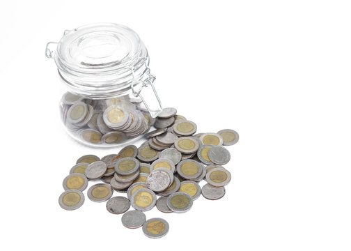 Glass jars with coins money on white background