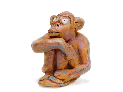 dreamy monkey  from clay pottery isolated on white