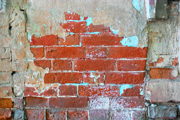 Old brick wall, half covered with cement, bright color
