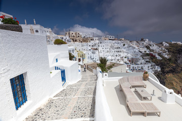 View of Oia traditional white houses and old castle of Oia, Sant