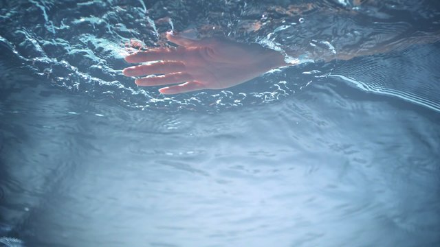 Putting hand into water shooting with high speed camera, phantom flex.
