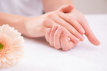 Pleasant woman making hand massage 