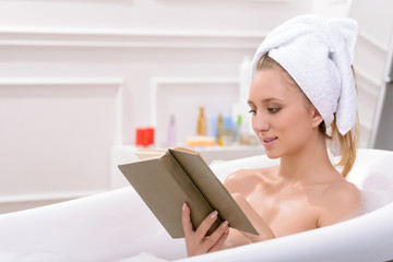 Attractive young woman taking a bath 