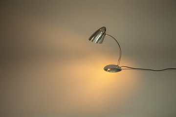 metal old lamp beam shines on a surface
