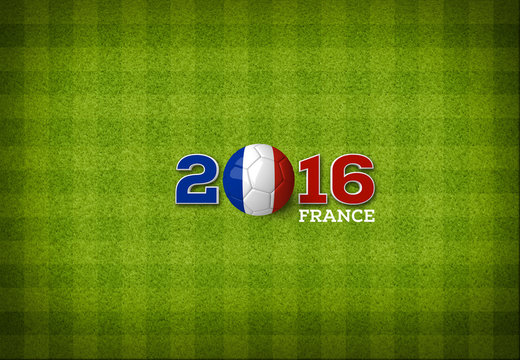 A soccer ball with a France flag on a top view of green stripped soccer filed.