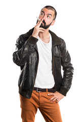 Fototapeta premium Man wearing a leather jacket smoking