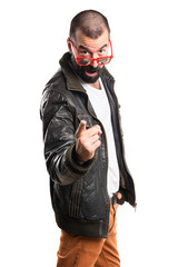 Man wearing a leather jacket pointing to the front