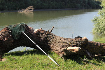 Landing net on river bank