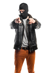 Robber pointing to the front