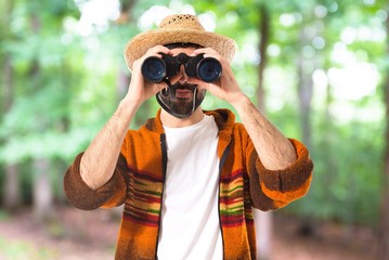 Tourist with binoculars over white background