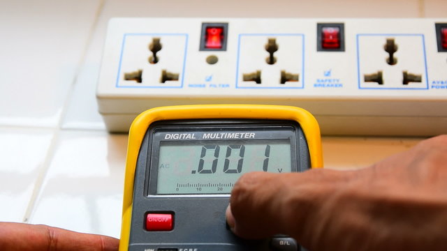Measure AC voltage with a digital multimeter.