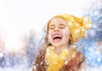 girl playing on a winter walk