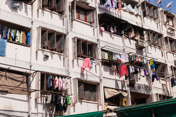 Fototapeta na wymiar House facade with clothes out to dry in Bangkok