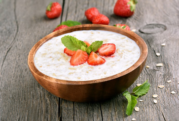Oats porridge with fresh strawberry