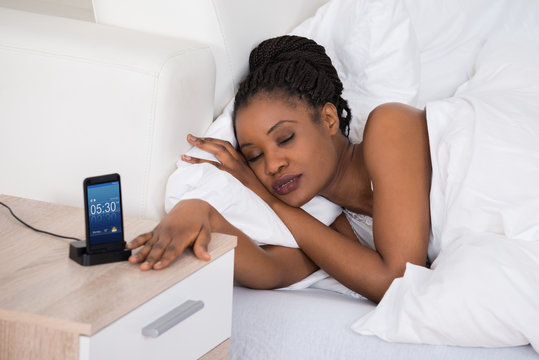African Woman Sleeping On Bed